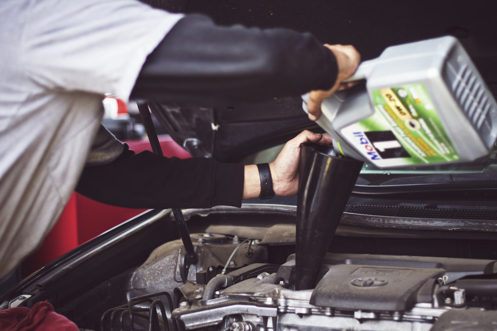Mechanic working under the hood